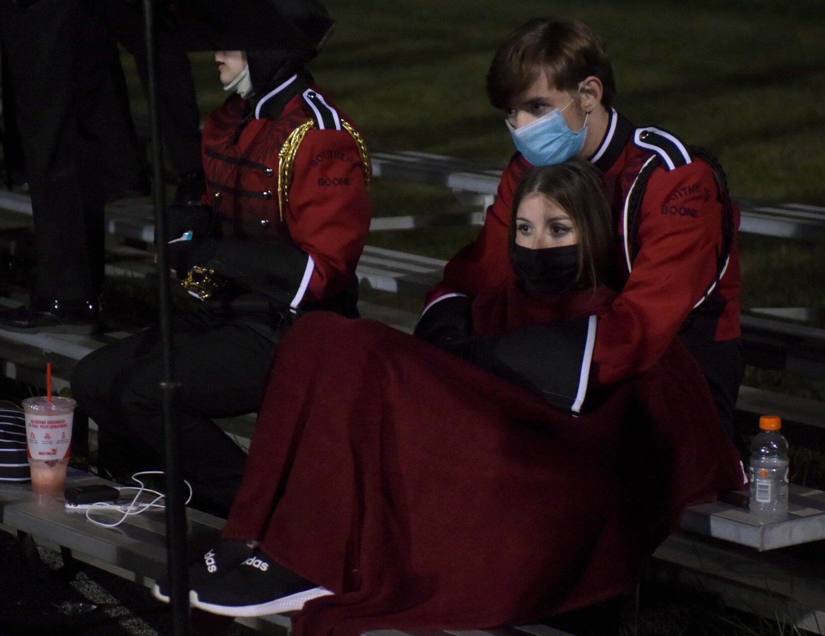 Southern Boone juniors Amanda Felmlee and Thomas Samuels rest against the bleachers